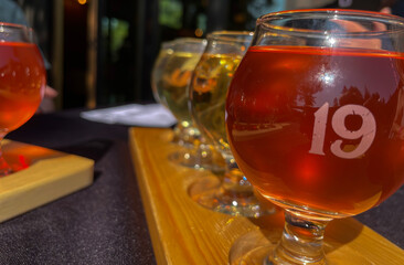Colorful Craft Cider Flight on Outdoor Patio table
