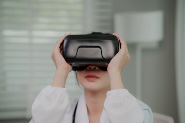 A female medical professional in a lab coat and stethoscope uses a VR headset, interacting with virtual reality in a futuristic healthcare setting.