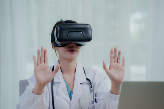 A female medical professional in a lab coat and stethoscope uses a VR headset, interacting with virtual reality in a futuristic healthcare setting.