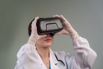 A gloved medical professional in a lab coat and stethoscope wears a VR headset, immersed in a...