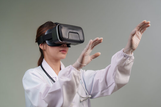 A gloved medical professional in a lab coat and stethoscope wears a VR headset, immersed in a virtual healthcare experience.