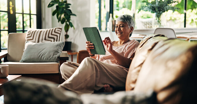 Senior, woman or relax with tablet on sofa for online bingo, gambling site and internet surfing. Retirement, old person or happy with digital tech in home for streaming subscription and app download - Powered by Adobe