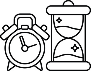 alarm clock sits next to a hourglass