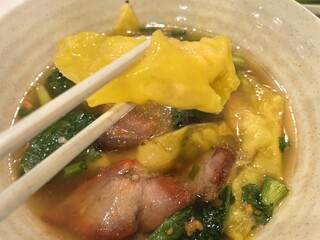 Authentic Thai wonton noodles with red pork in broth