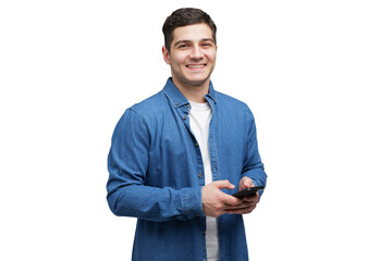Young Man in Casual Outfit Engages With Smartphone While Smiling, Capturing a Joyful Moment Indoors