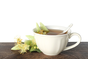 Tasty linden tea in cup, leaves and flowers on wooden table against white background