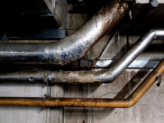 Industrial Metal Pipes on the Walls in a Car Park Building