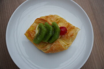Berry-topped bliss! Indulge in this exquisite sweet pastry, beautifully captured. Ideal for...