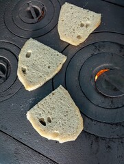 close up of a piece of bread on old traditional Romanian stove