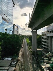 Railway tracks beneath an elevated train line in Bangkok