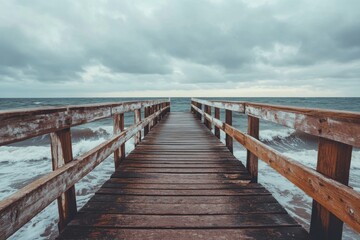 Obraz premium Tranquil seascape vintage wooden pier overlooking calm waters coastal environment perspective viewpoint nature concept for serenity