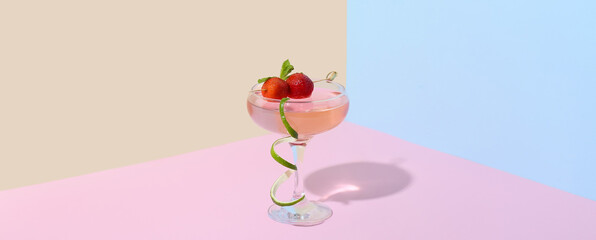 Glass of tasty cosmopolitan cocktail on color background