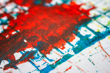 Extreme close up of colorful acrylic paint texture showing brush strokes. Selective focus.