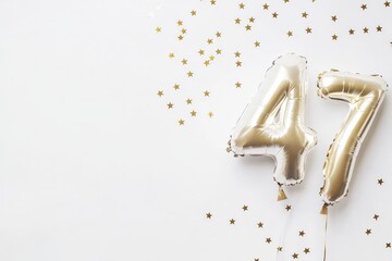 Fototapeta premium Gold foil balloons forming number 47 with star confetti on white background
