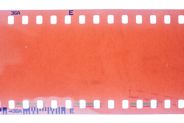 Dusty and grungy 35mm film texture or surface. Perforated scratched camera film isolated on white...