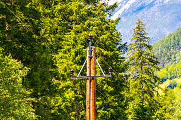 Alpine mountain landscape panorama of Lechtal Austria blue sky Power pole.