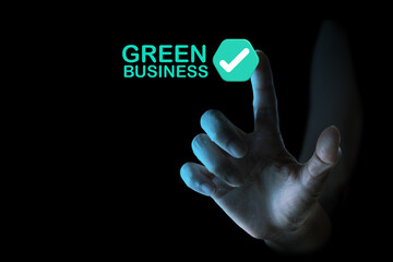 Hand Pointing to Green Business Check Mark Icon on Black Background