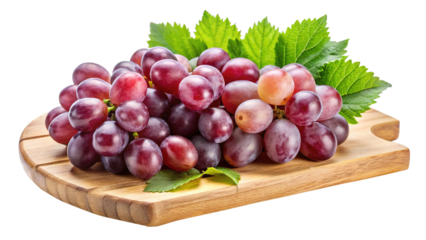 Cluster of fresh red grapes on wooden cutting board, isolated view