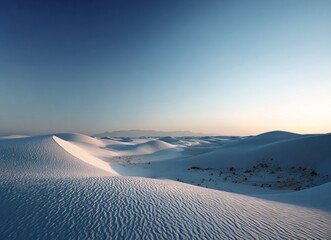 White dunes at twilight, the vast expanse of sand stretching to infinity under the dim glow of dusk. The tranquil scene captures the serene beauty and endlessness of desert landscapes. High-resolution