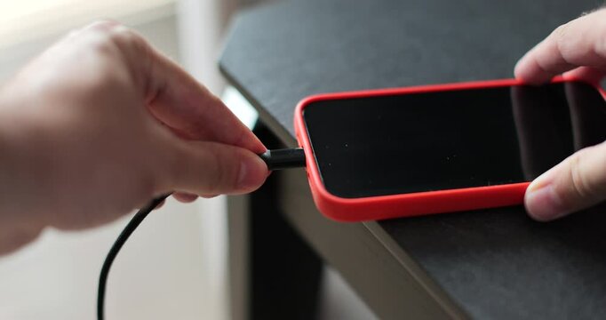 Close-up of the charging connection to smartphone. Phone charging port. Mobile smartphones charging.