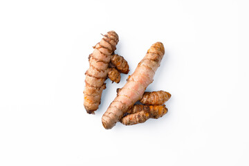 Turmeric with its magnificent orange color on a white background