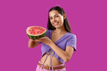Beautiful young woman with half of fresh watermelon on purple background