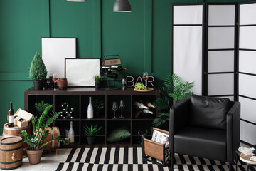 Interior of modern living room with different types of wine in bottles and barrels