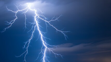 A Dramatic Photograph of a Massive Lightning Bolt Striking the Night Sky
