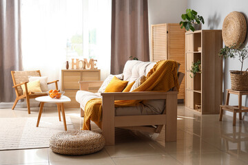 Interior of modern living room with white sofa, coffee table and armchair