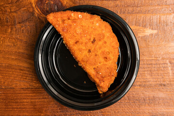 Empanada in a container