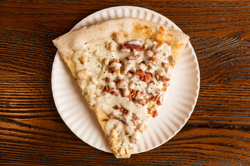 Slice of chicken bacon ranch pizza