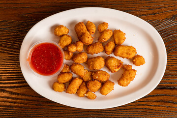 Fried cheese curds with marinara sauce