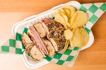 Sandwich on an everything bagel with potato chips