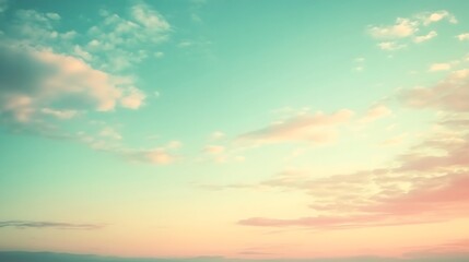 Fototapeta premium Soft, pastel colors of a sunset sky with clouds.