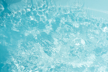 Blue water with ripples on the surface. Defocus blurred transparent blue colored clear calm water...
