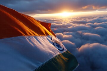An Indian flag is seen above the clouds at sunset with the sun visible in the background