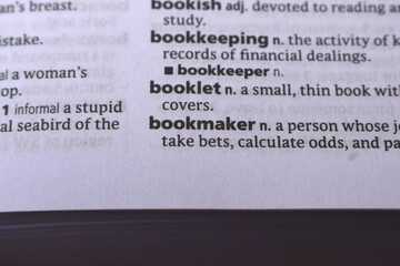 Close Up Of English Dictionary Page With Word - Bookmaker