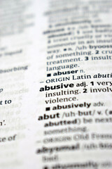 Close Up Of English Dictionary Page With Word - Abusive