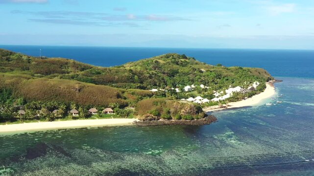 Aerial panning around Tokoriki island in Fiji &ndash; coral reefs pristine beaches with tourism resort.
