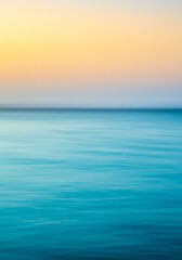 Obraz premium Serene Ocean Sunset: Blue And Orange Water Horizon