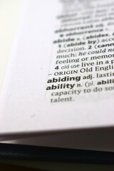 Close Up Of English Dictionary Page With Word - Abiding