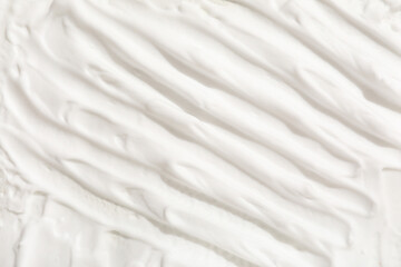 Texture of white cream as background