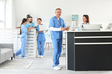 Group of medical interns working at reception in clinic