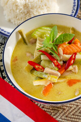 Vibrant Thai curry with fiery chili bursts and lush greens, perfect for Songkran celebrations and culinary exploration