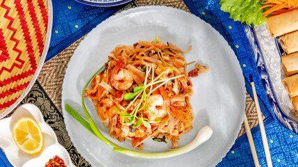 Pad Thai symphony with vibrant shrimp twirls, Lunar New Year feast, culinary harmony, bamboo placemat tales, tantalizing umami poetry