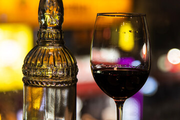bottle and a glass of wine