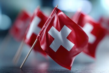 Several Swiss flags are displayed with a bright white cross centered on a red field