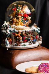 Close up of Christmas globe that has several species of animals included.