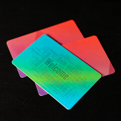 Multi colored hotel cards. They feature the word welcome.