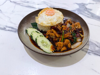 halal cuisine main course menu gong bao fried chicken chop with onion spicy chilli sauce and egg white rice cucumber in plate on marble table hotel restaurant banquet asian chinese cafe